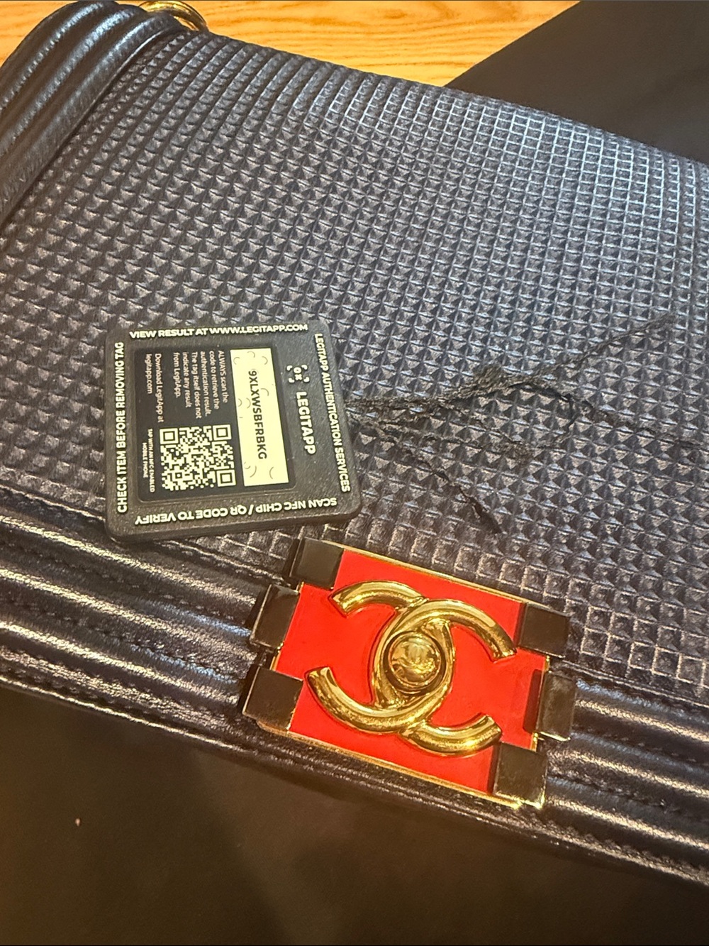 CHANEL Black Leather Shoulder Bag with Gold Chain and Red Accent - Picture 12 of 16